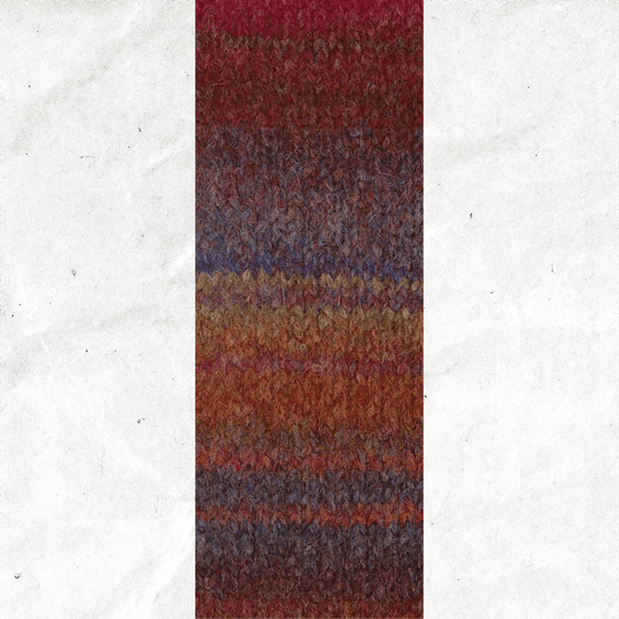 A yarn swatch showing the self striping pattern of the red, brown, and purple tones.