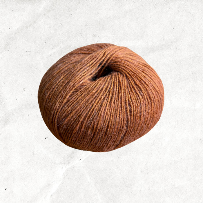Orange brown ball of yarn.