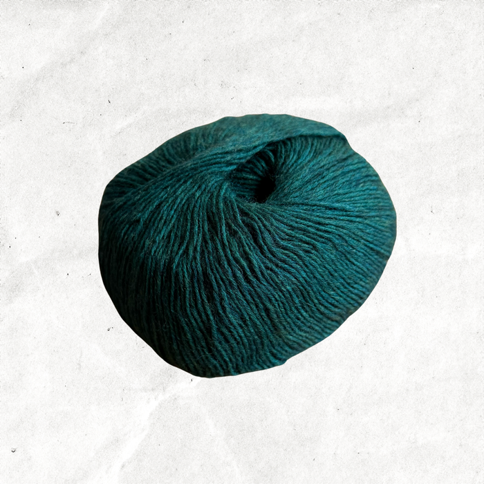Forest green ball of yarn.