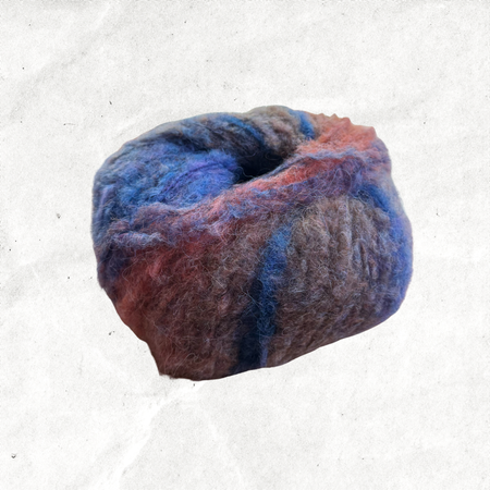 A fluffy ball of yarn with blue, purple, and orange tones.
