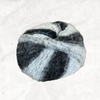 A fluffy ball of yarn with white and black tones.