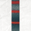 A yarn swatch showing the self striping pattern of the red, orange, and blue-grey tones.