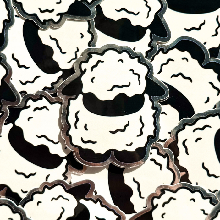 Collage of a black and white sheep sticker.